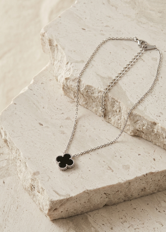 The Midnight Clover Charm